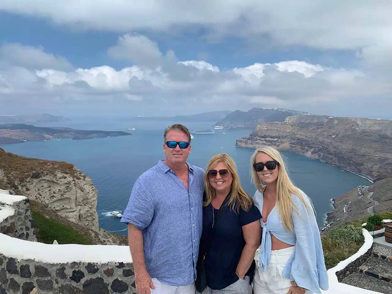 Family on a private tour posing above the Santorini caldera