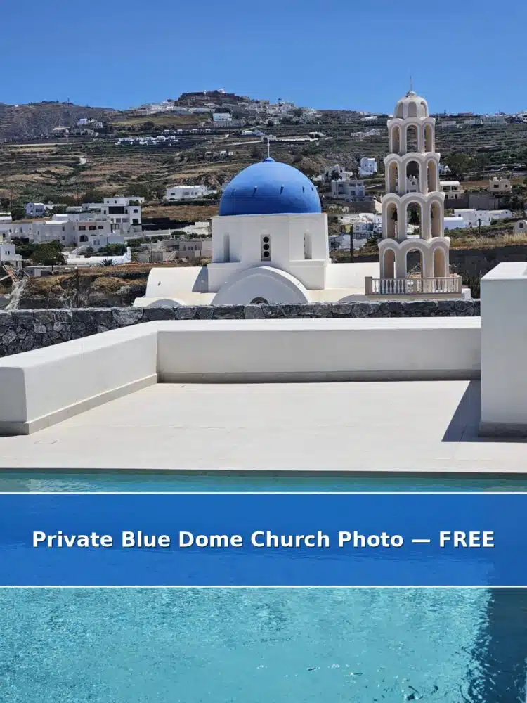 Blue-domed church overlooking the caldera in Oia, Santorini