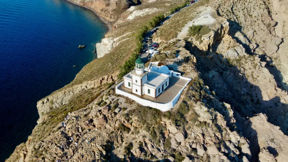 Aerial view of the Akrotiri lighthouse during a private sightseeing helicopter tour